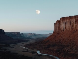 A breathtaking view of cliffs under a full moon at twilight.