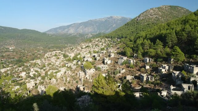 Panoramic view of Kayakoy or Levissi. Historic stone churches and houses. Abandoned town near Fethiye. Mugla province, Turkey country