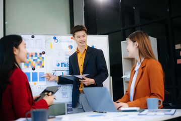 Happy businesspeople while collaborating on a new project in an office. Group of diverse businesspeople