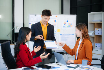 Happy businesspeople while collaborating on a new project in an office. Group of diverse businesspeople