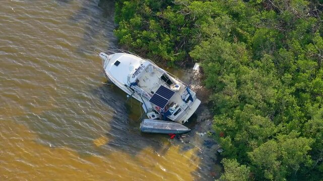 Natural disaster consequences. Destroyed sailboats after hurricane in Florida.