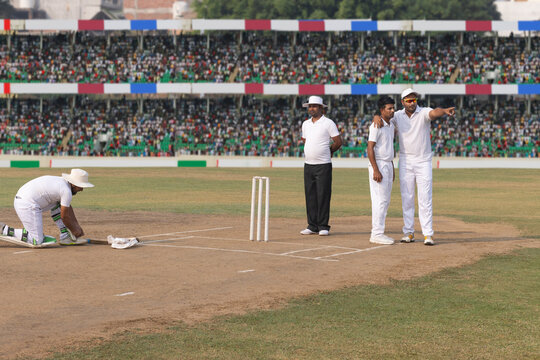 Before the game starts, the bowler and caption positions the fielders, during the cricket game