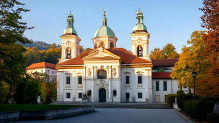 Fototapeta premium Autumnal basilica facade, park setting, sunlight, tranquil scene, travel photography