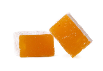 Colorful Turkish delight squares with a soft texture on a white background, showcasing a traditional sweet treat