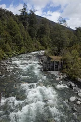 Historic wooden bridge across a mountain stream in the Patagonian Andes, Carretera Austral, Ruta CH7 road, Panamerican Highway, Los Lagos Region, Chile, South America, America, South America