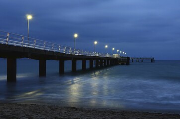 Obraz premium Blue Hour Sea Bridge, Timmendorfer Strand, Baltic Sea, Schleswig-Holstein, Germany, Europe
