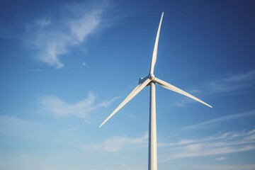 Fototapeta premium Wind energy turbine in front of blue sky. KI generiert, generiert AI generated
