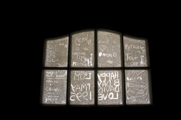Graffiti on glas plate at ghosttown Kolmanskoop in Namibia