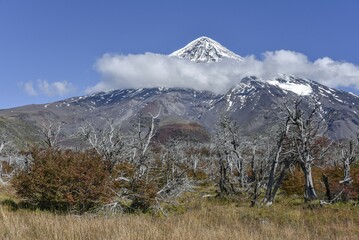 Snow covered volcano Lanin, summit surrounded by clouds, between San Martin de los Andes and Pucon, National Park Lanin, Patagonia, Argentina, South America