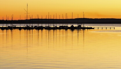 Fototapeta premium Jetty and sailing boats, sunset, Lake Steinhuder, Steinhude, Lower Saxony, Germany, Europe