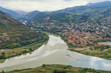 Naklejka premium View over Aragvi River and Mtskheta Holy Cross Church, Unesco World Heritage Site, Mtskheta, Mtskheta-Mtianeti province, Georgia, Asia