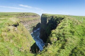 Rugged coastal landscape at Duncansby Head, nature reserve and breeding area for many water birds,...
