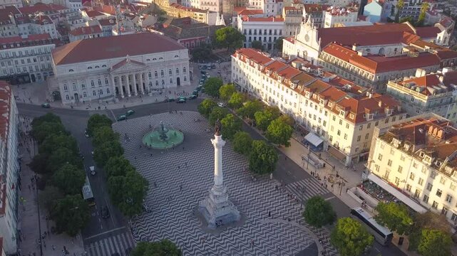 LISBON, PORTUGAL - JANUARY 22, 2025: Birds eye view of Rossio Square showcasing fountains and historic architecture during a sunny day