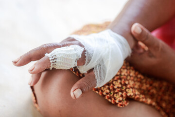 Hand of woman injured and bandaged