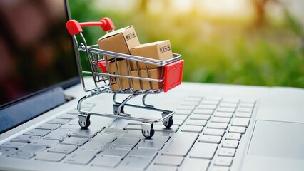 Mini Shopping Cart with Cardboard Boxes on Laptop Keyboard, Online Shopping Concept