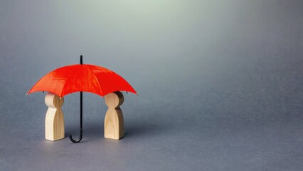 Protective Red Umbrella Sheltering Wooden Figures, Minimalist Insurance Concept