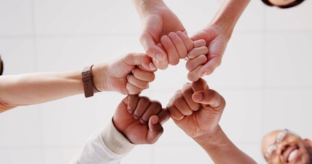Below, hands and people with fist bump for teamwork, creative collaboration and diversity in...