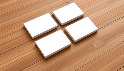 Elegant blank business cards displayed on a wooden background, ideal for showcasing branding, design templates, and corporate identity