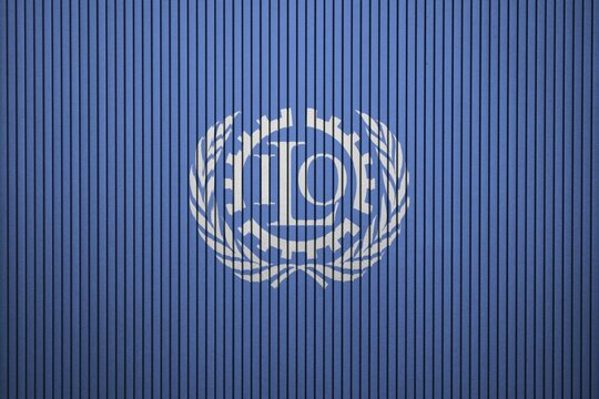 ILO Flag painted on the cracked grunge concrete wall, International Labour Organization