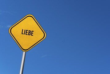 Liebe, yellow sign with blue sky