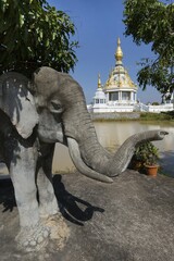 Obraz premium Elephant figure in front of Maha Rattana Chedi of Wat Thung Setthi, Khon Kaen, Isan, Thailand, Asia