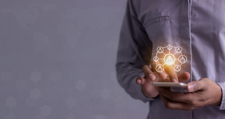 Young man hand using smartphone to Interconnect, Interconnected Concept; People connect via wireless internet in a world of digital technology and communications that connect freely around the world