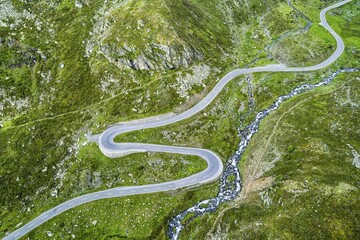 Aerial view, curvy mountain pass road Flüelapass, with clouds, canton of Grisons, Switzerland, Europe