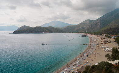 Fototapeta premium Oludeniz beach in the autumn season. Holiday on the Mediterranean coast of Turkey. Fethiye district, Mugla province, Turkey country 