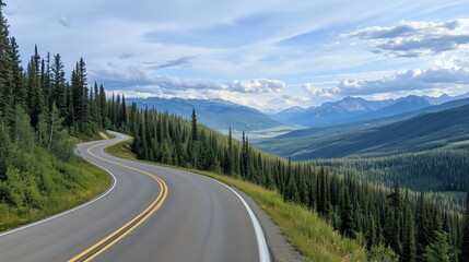 Naklejka premium Winding road through lush green forest leading to distant mountains under a cloudy blue sky. Travel and exploration.