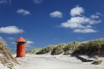 Little red lighthouse in the dunes near Agger Tange, Jutland, Denmark, Europe