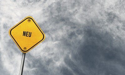 Neu, yellow sign with cloudy sky