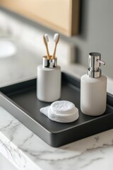 Modern bathroom accessories on a tray.