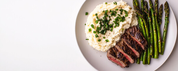 Delicious steak served with creamy mashed potatoes and grilled asparagus, creating balanced and appetizing meal. Perfect for hearty dinner or special occasion