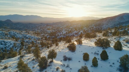 Snowy mountain landscape at sunset.