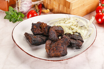 Grilled beef barbecue served onion