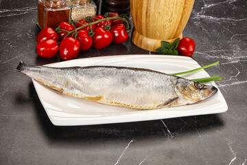 Whole raw salted herring fish