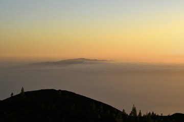 View from Samara Volcano across Teno massif towards La Palma in trade clouds, sunset, Teide National Park, Tenerife, Canary Islands, Spain, Europe