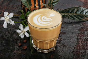 Hot cappuccino coffee in the glass