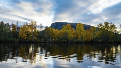 Fototapeta premium Autumn landscape, Kvikkjokk Delta, mirroring in the Tarraätno River, Sarek National Park, Norrbottens, Norrbottens län, Laponia, Lapland, Sweden, Europe