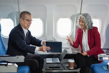 Fototapeta premium Presenting a business plan, a professional venture capitalist discusses a new project, presenting ideas while sitting on a private jet.