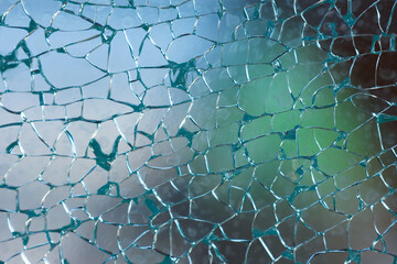 Macro shot of broken shattered window glass abstract background.