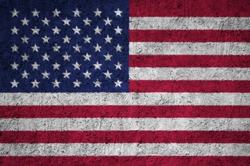 Fototapeta premium American flag painted on a rough concrete surface with stars and stripes, United States Flag