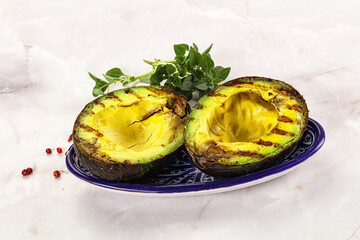 Sliced fresh avocado on the grill