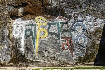 Mural Painting, Buddhist Mantra, Om mani padme hum, Choedrak Monastery at 3800 m, Bumthang, Himalaya, Kingdom of Bhutan © Tommy Seiter/imageBROKER