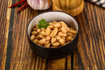 Baked white canned beans in the bowl