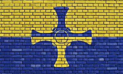 Flag of County Durham painted on brick wall