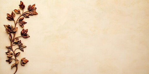 An elegant composition of a dry branch with bronze leaves on a textured beige background, creating a minimalist and natural aesthetic