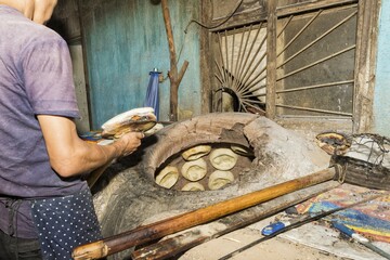 Kyrgyz man preparing the traditional Kyrgyz bread, Kochkor village, Road to Song Kol Lake, Naryn province, Kyrgyzstan, Central Asia, Asia