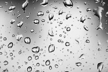Water drops on a window pane, glass pane, window, rain, bad weather, full-frame, background image