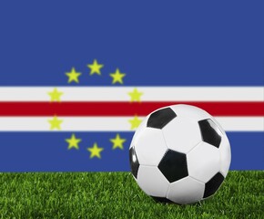 Naklejka premium The Cape Verde flag and soccer ball on the green grass